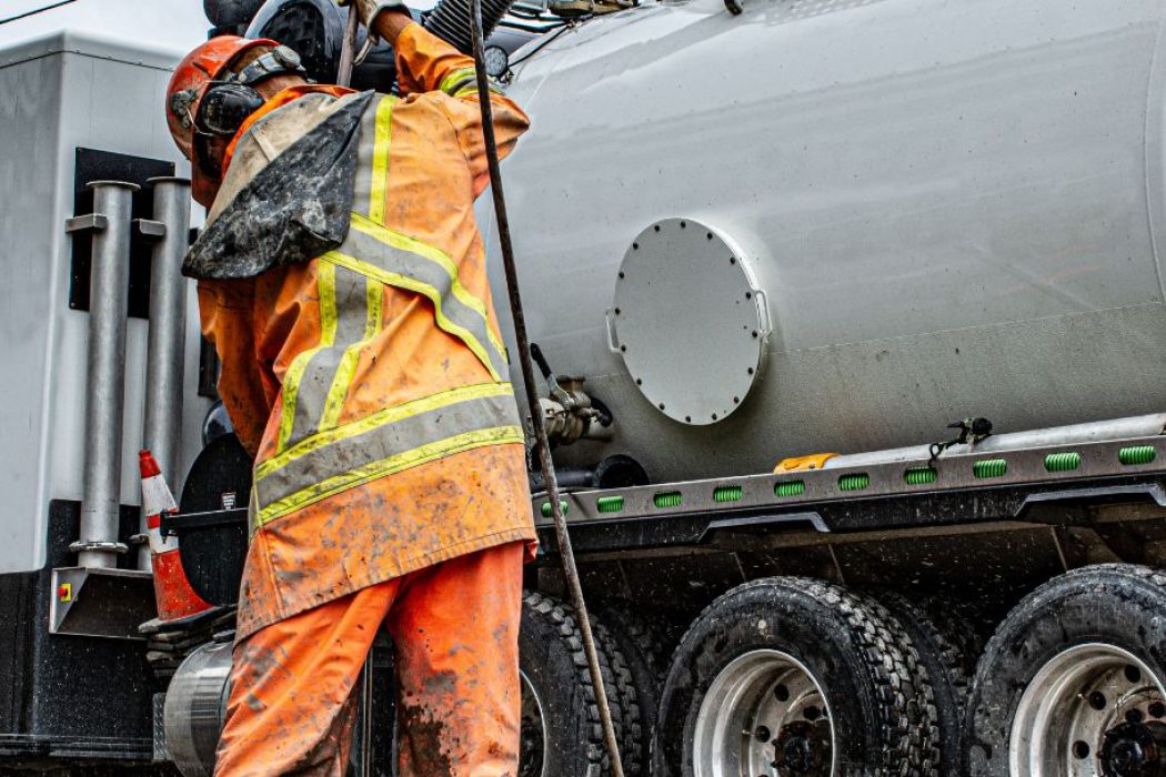Heavy-duty vacuum truck in action on site